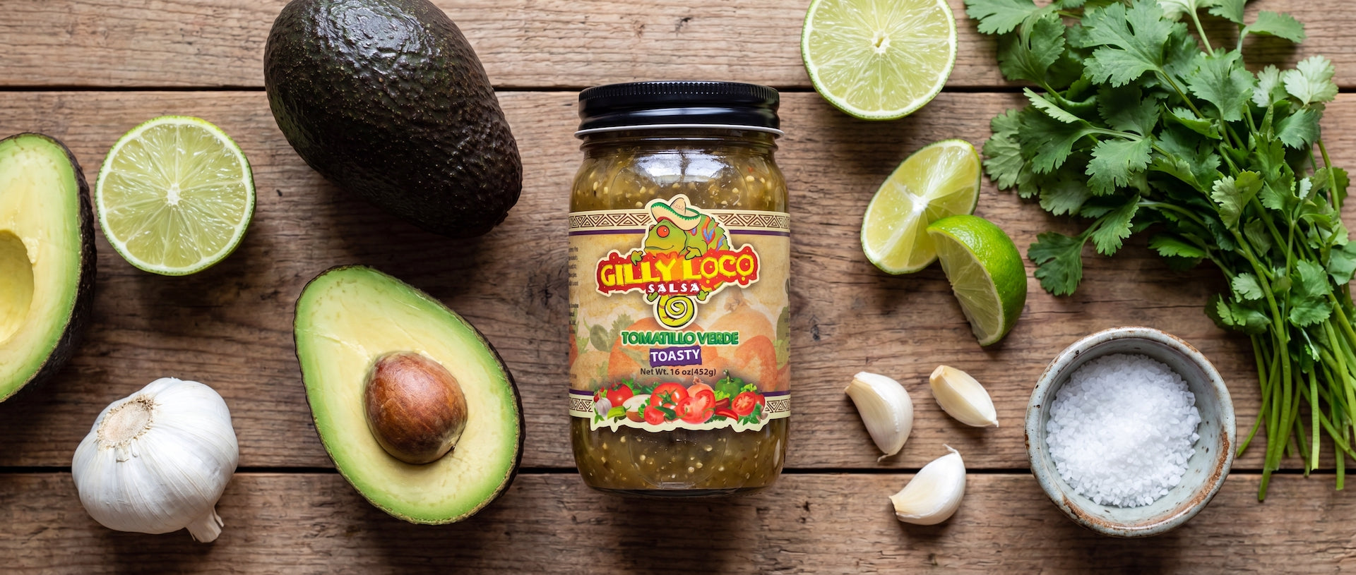 Fresh tomatillo guacamole topped with cilantro and cheese, served with blue corn tortilla chips and made with Gilly Loco Tomatillo Salsa.