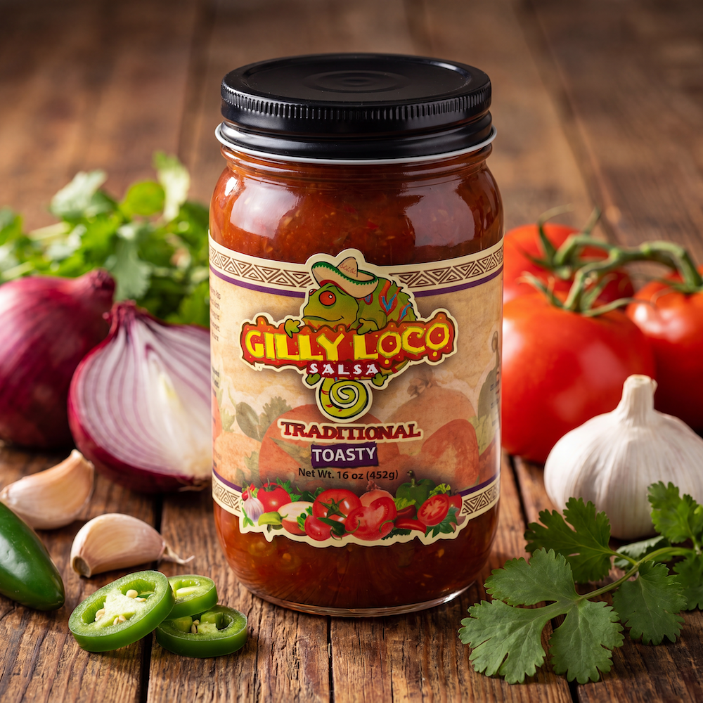 Jar of Gilly Loco Traditional Salsa surrounded by fresh tomatoes, jalapeños, garlic, onion, and cilantro on a rustic wooden table, showcasing the real ingredients behind its bold New Mexico flavor.